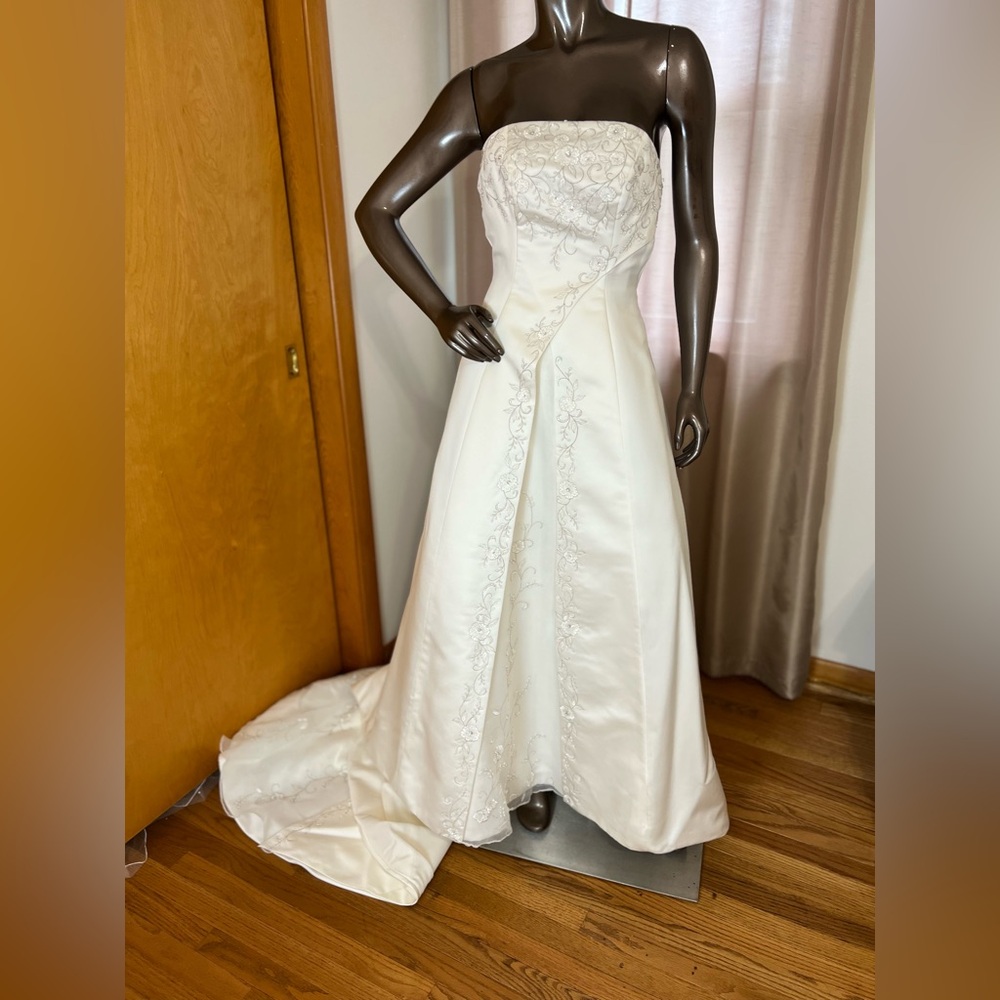 Ivory vintage Jasmine wedding gown with cathedral training.